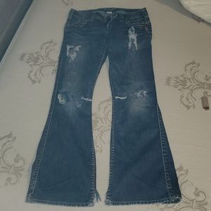 Silver jeans with lots of holes w26/L31